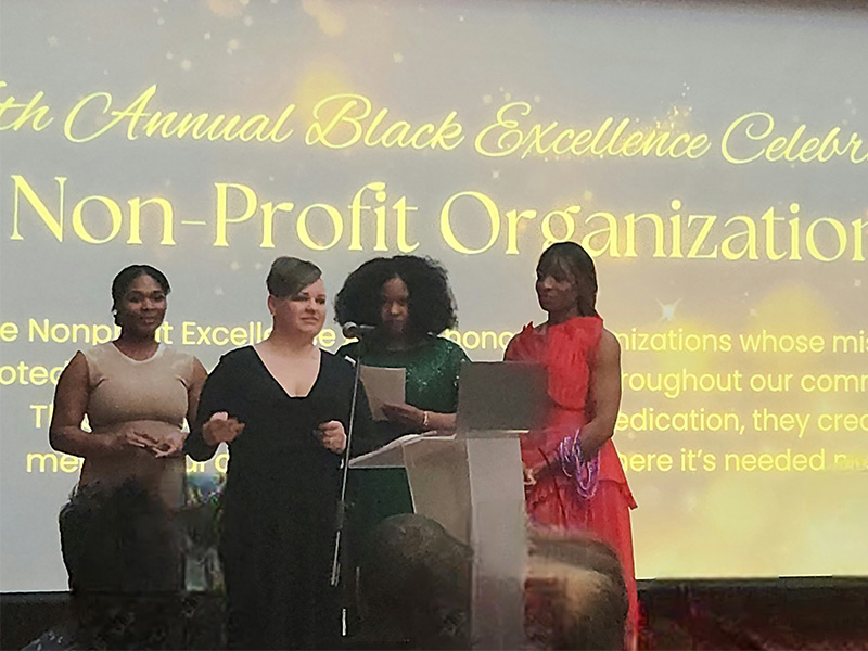 Couleecap staff accept Black Excellence Award